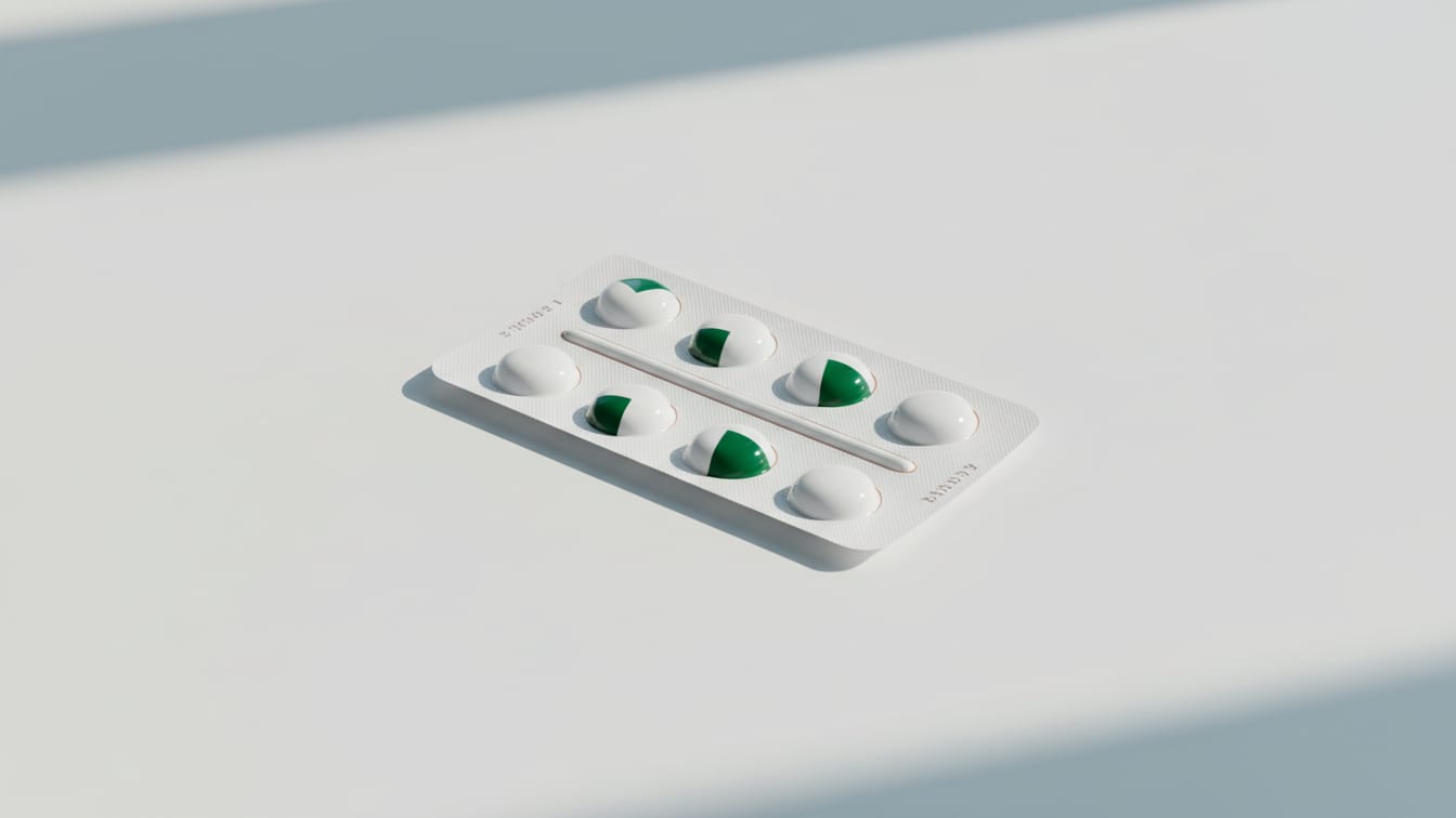 Illustration: A stark white, unbranded blister pack on a white surface with soft light.