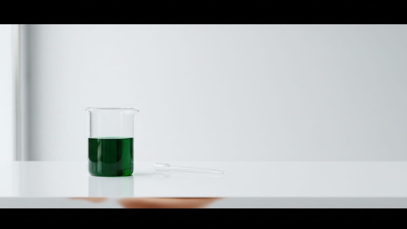 Illustration: A clear glass beaker with green liquid and a pipet on a white lab bench with copper reflection.