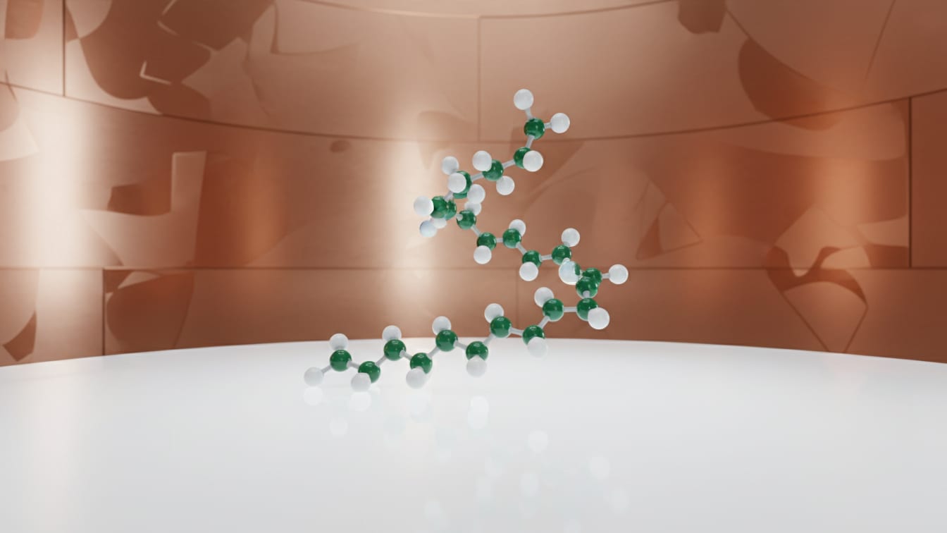 Illustration: A molecular model of a peptide chain in white and deep green on a white surface with a copper accent.